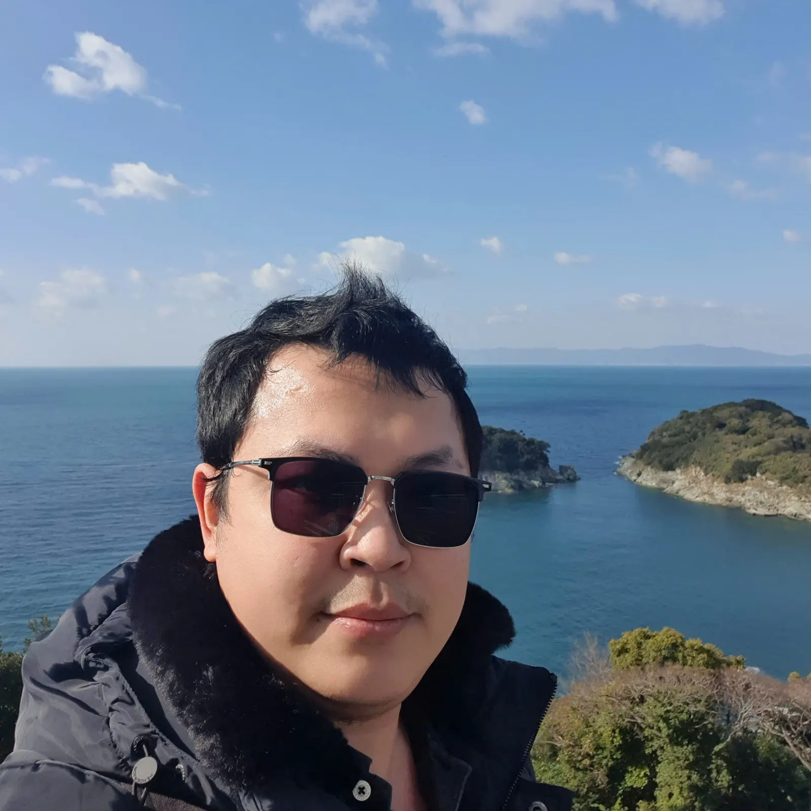 Alex Ngo portrait by the sea